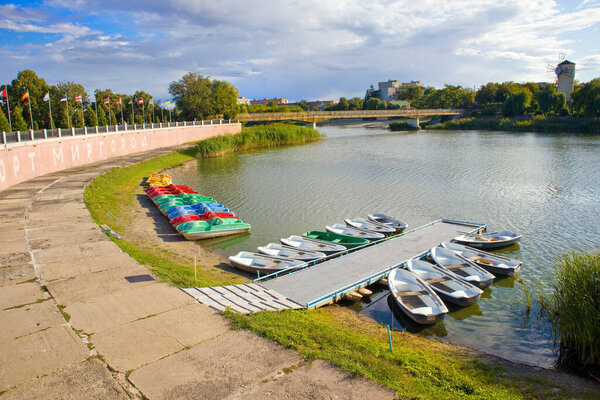 Landscape with boats at the Khorol River in Myrhorod, Ukraine