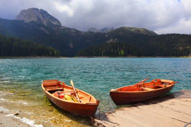 Boats on Black Lake in Durmitor National Park in Montenegro