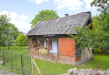 Old wooden house in sunny day in Yaremche, Ukraine