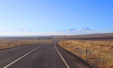 Landscape with road and mountains in sunny day in Turkey