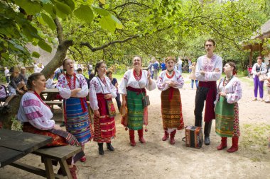 Ukrainian National Folk Vocal Ensemble sings in Cossack village (museum) Mamaeva Sloboda in Kyiv, Ukraine