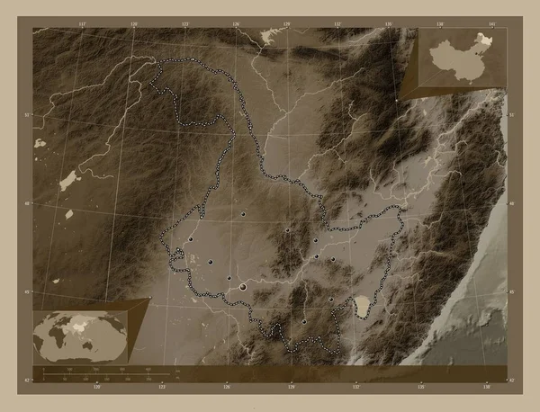 Heilongjiang, province of China. Elevation map colored in sepia tones with lakes and rivers. Locations of major cities of the region. Corner auxiliary location maps