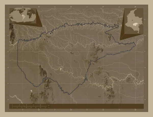 Guaviare, commissiary of Colombia. Elevation map colored in sepia tones with lakes and rivers. Corner auxiliary location maps