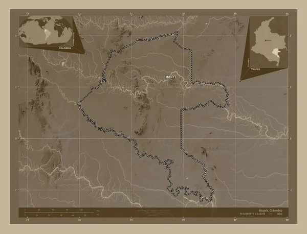 Vaupes, commissiary of Colombia. Elevation map colored in sepia tones with lakes and rivers. Locations and names of major cities of the region. Corner auxiliary location maps