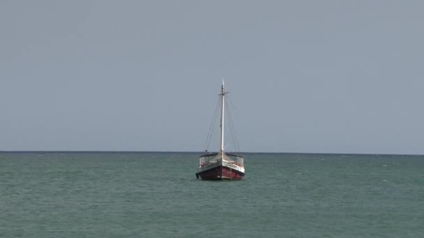 Sailboat Tied Anchor Sail Calm Sea Big Blue Sky — Stock Video