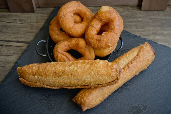 Rosquillas and casadielles on slate, typical sweets from Asturias, in Spain. High quality photo