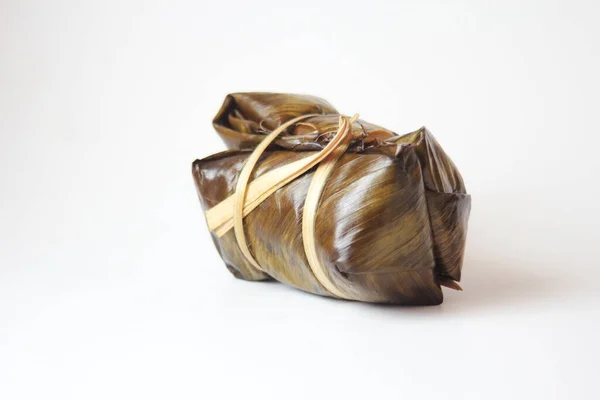 Thailand rice cakes bundle wrapped banana leaves on a white background