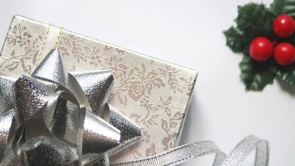 silver gift box and silver ribbon on white background