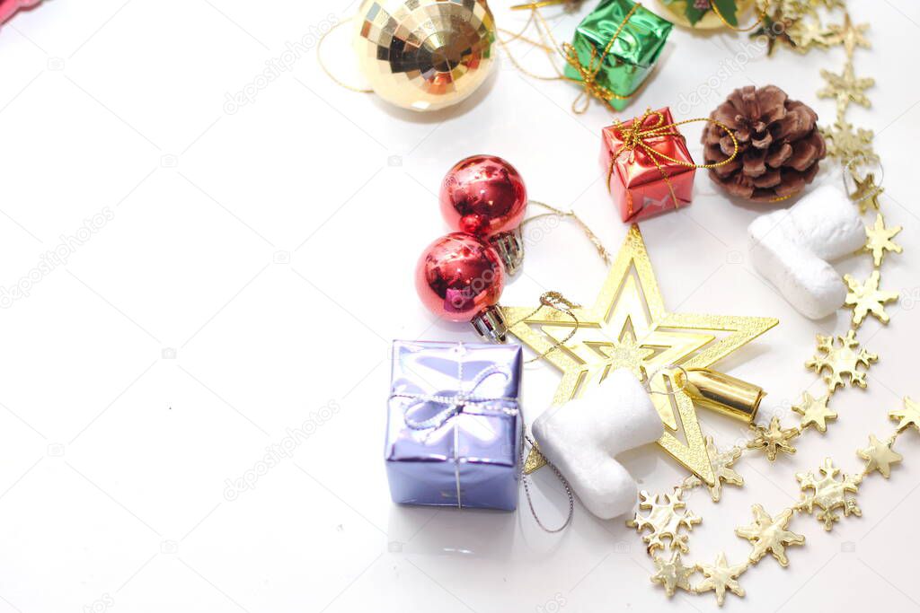 Christmas decorations placed on a white background