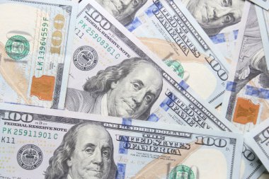 100 dollar US banknotes placed on a white background.