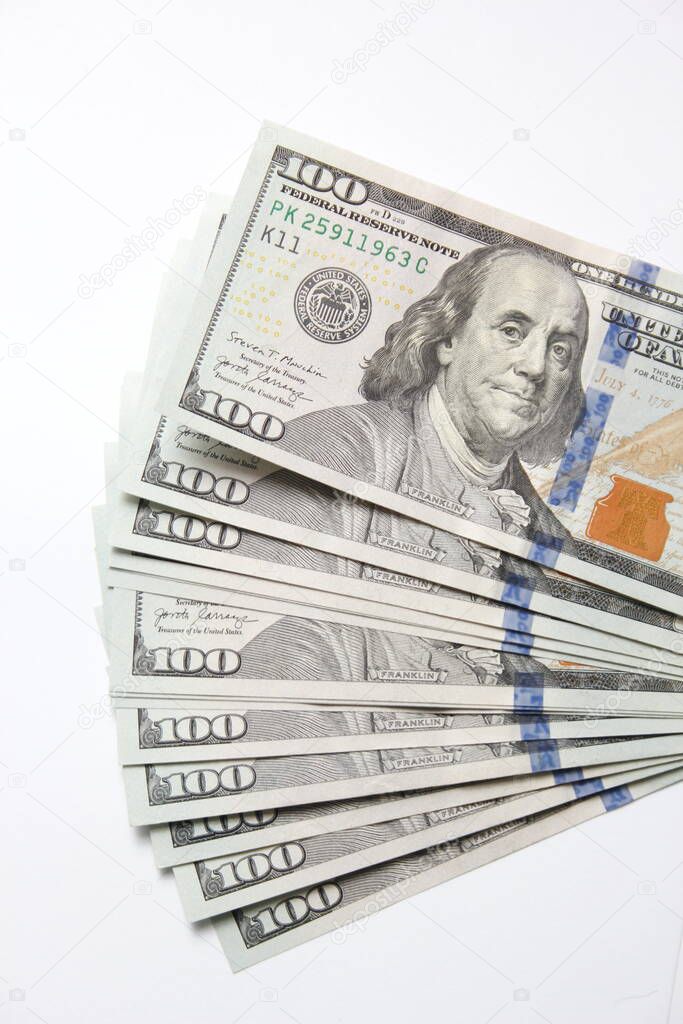100 dollar US banknotes placed on a white background.