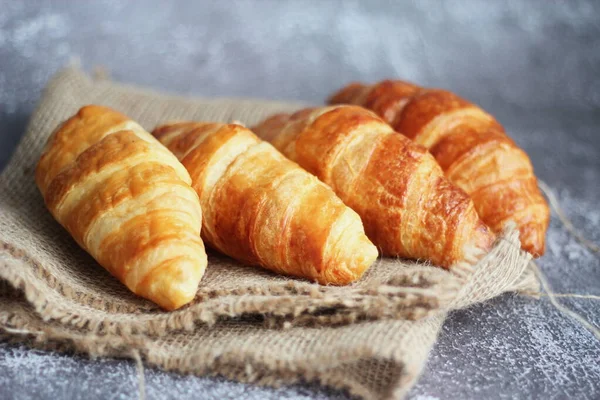 Croissant Bread Stacked Table Wooden Plates Sackcloth — Stock Photo, Image