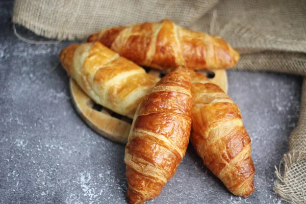 Croissant Bread Stacked Table Wooden Plates Sackcloth — Stock Photo, Image