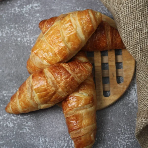 Croissant Bread Stacked Table Wooden Plates Sackcloth — Stock Photo, Image