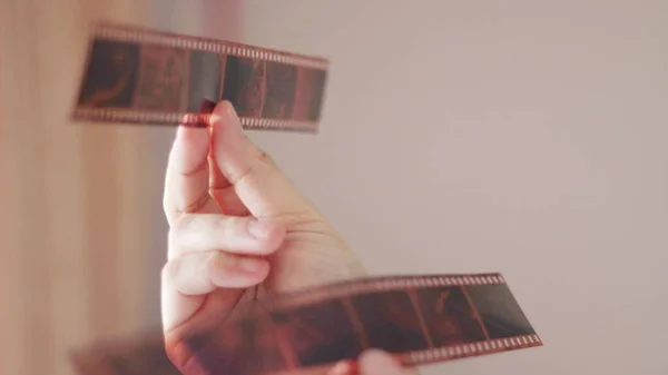 Woman Hand Holding Film Film Shining Light Room — Stock Photo, Image