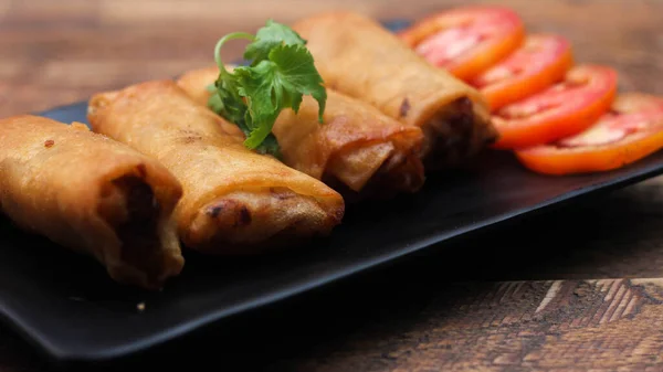 Fried Spring Rolls Served Black Square Plate Sliced Tomatoes Brown — Stock Photo, Image