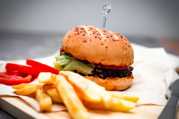 Beef Burgers Served Paper French Fries Tomatoes Popular Food — Stock Photo, Image