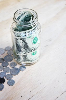 US dollars in jam jars, family savings, poor people's savings.