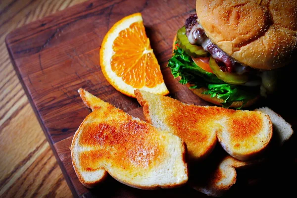 Deluxe Burgers Hamburgers Being Decorated Serving Wooden Cutting Board Consisting — Photo