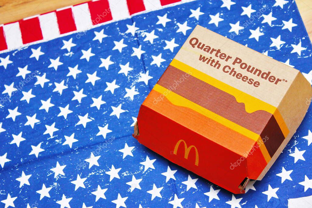 WASHINGTON, USA - JULY 02 2022 : McDonald's Burgers, Quarter Powder and Cheese on American Flag Cloth, McDonald's Burgers loved in America and around the world.