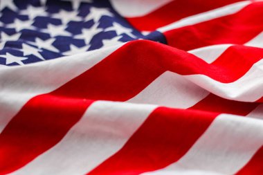 american flag placed on a black wooden table On American Independence Day.