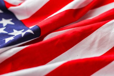 american flag placed on a black wooden table On American Independence Day.