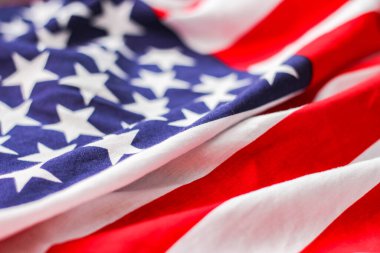 american flag placed on a black wooden table On American Independence Day.
