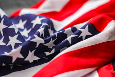 american flag placed on a black wooden table On American Independence Day.