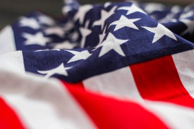 american flag placed on a black wooden table On American Independence Day.