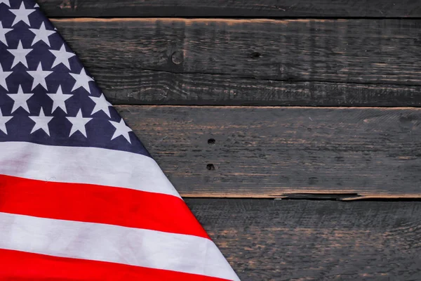 american flag placed on a black wooden table On American Independence Day.