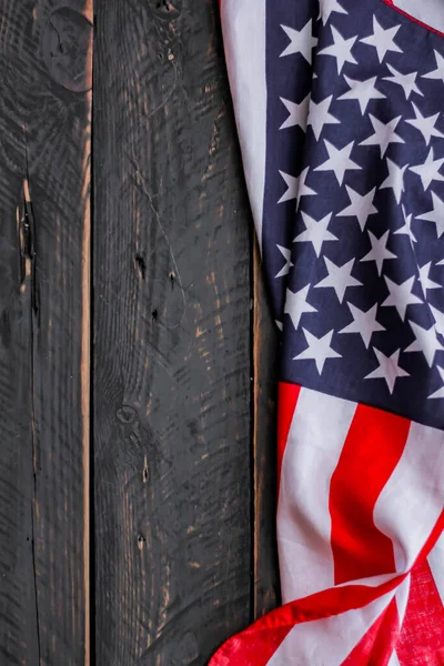 american flag placed on a black wooden table On American Independence Day.