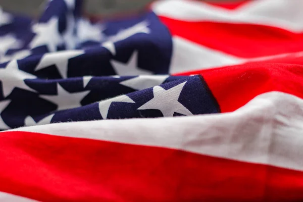 american flag placed on a black wooden table On American Independence Day.