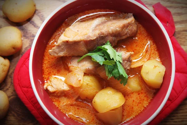 Hot traditional Thai beef massaman curry, thai cuisine, horizontal view from above