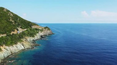 The Genoese Tower of Osse in the green countryside , Europe, France, Corsica, towards Bastia, by the Mediterranean Sea, in summer, on a sunny day.