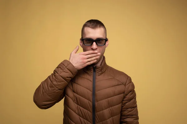 Young Man 20S Brown Jacket Yellow Background Sad Wearing Glasses — Fotografie, imagine de stoc