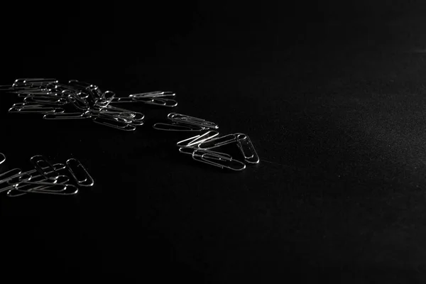 Metal Paper Clips Lie Black Background — Stock Photo, Image