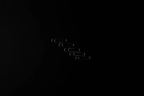 Metal Paper Clips Lie Black Background — 스톡 사진