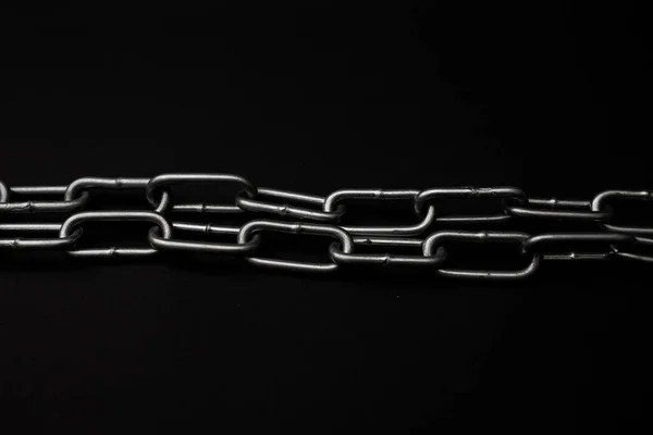 Large Gray Metal Chain Lies Black Background — Stockfoto