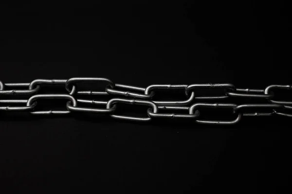 Large Gray Metal Chain Lies Black Background — стоковое фото