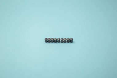 Gray metal bullets from the pistol lie