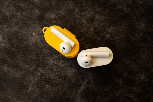 Bright musical headphones lie on a table