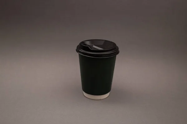 Disposable coffee cup with plastic lid