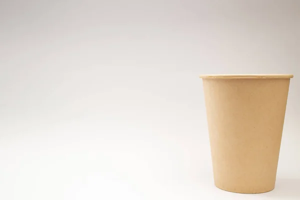Disposable paper cup on white background, social theme