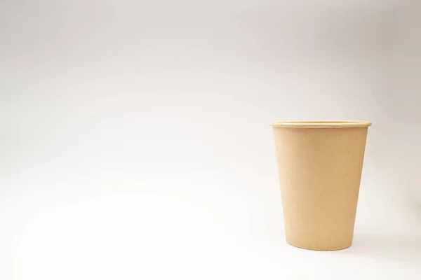 Disposable paper cup on white background, social theme