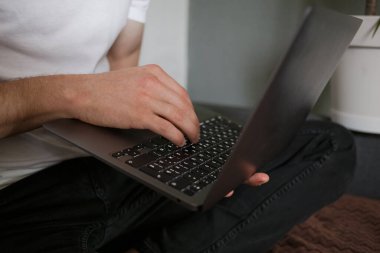 The guy works at home on his laptop