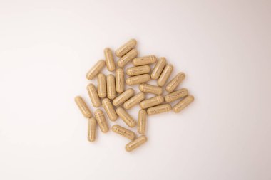 Pills with the badas, dietary supplement on a white background