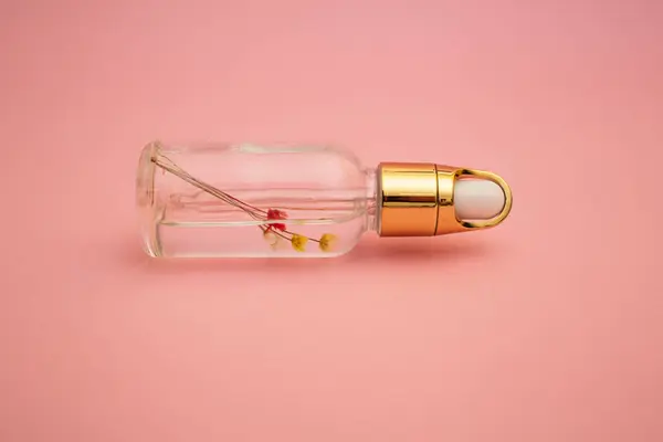 Hand Body Care Oil Pink Background Subject — Zdjęcie stockowe