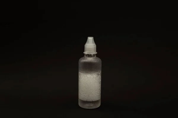 Transparent Bottle Liquid Black Background — Stock Photo, Image