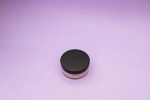 Facial Powder on Purple Background