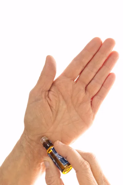 Applying scented oil to the wrist. Aromatherapy concept — Stock Photo, Image